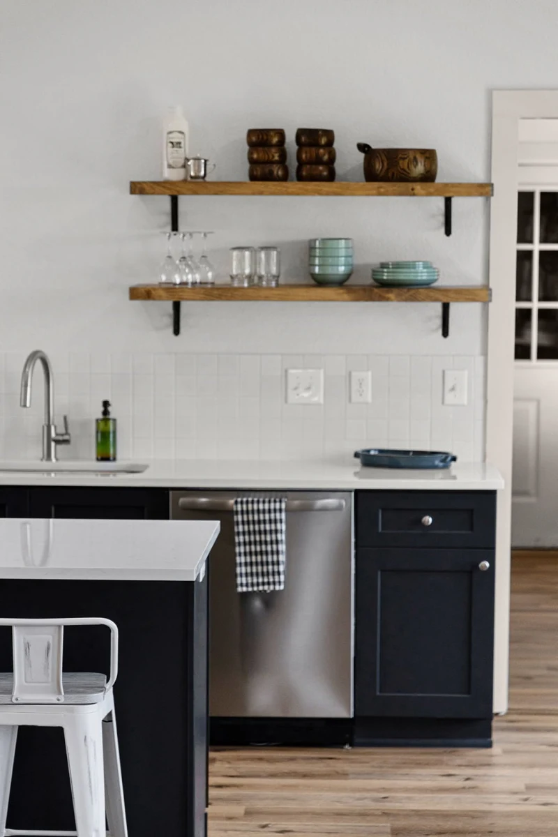 Barn House great room — second angle showing kitchen and dining
