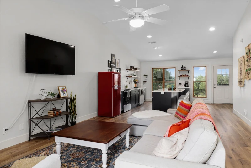 Barn House living — fireplace and sectional view