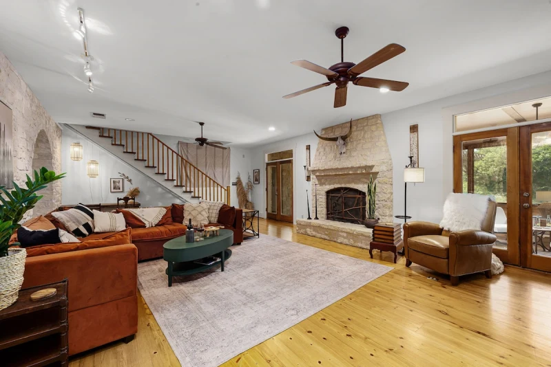 Main House living room — second angle showing natural light and hardwood floors