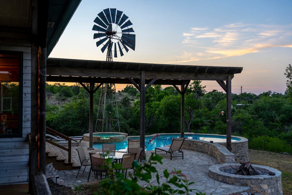 Private L-shaped pool with the windmill in view